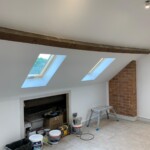 Angled ceiling with wooden support beam