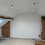 newly painted room with exposed brick supports