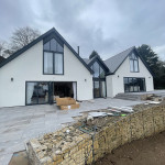 New build house with external rendering and bifold doors