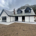 rendered house with 2 dormer windows